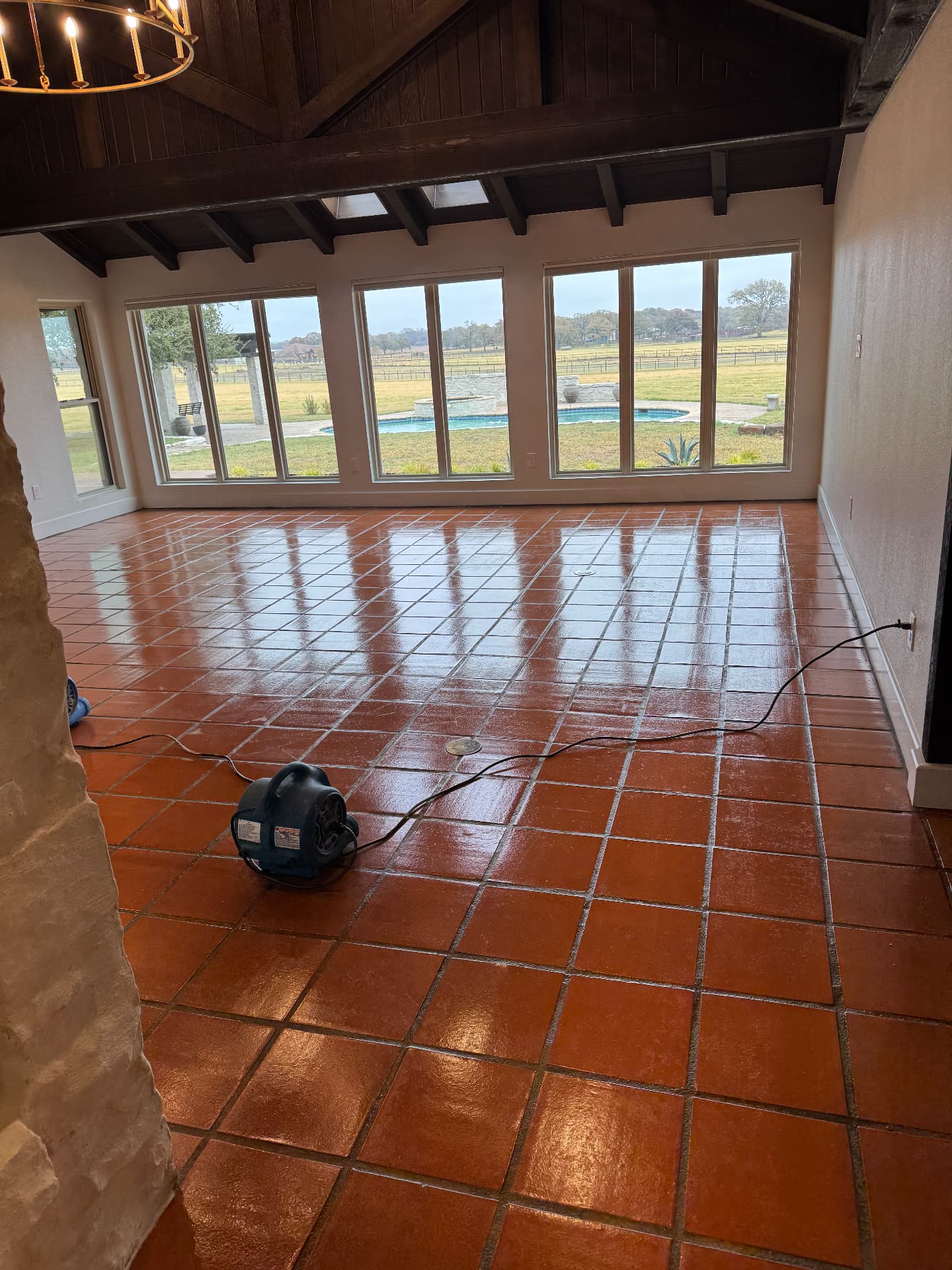 Shiny red tile floor restored to original color