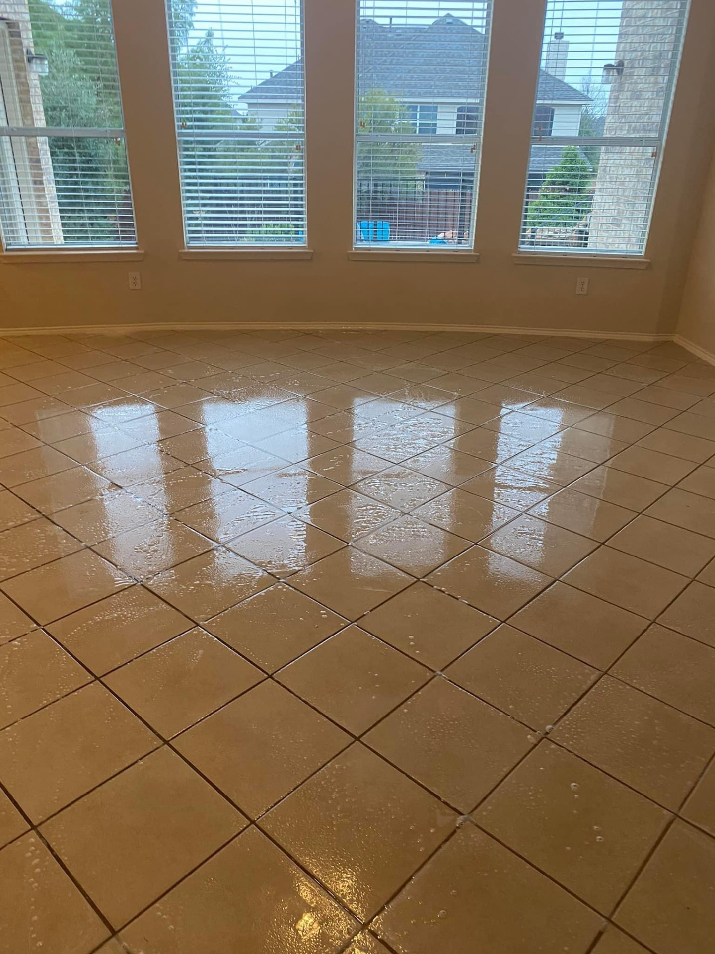 Glossy tan tile floor after professional cleaning